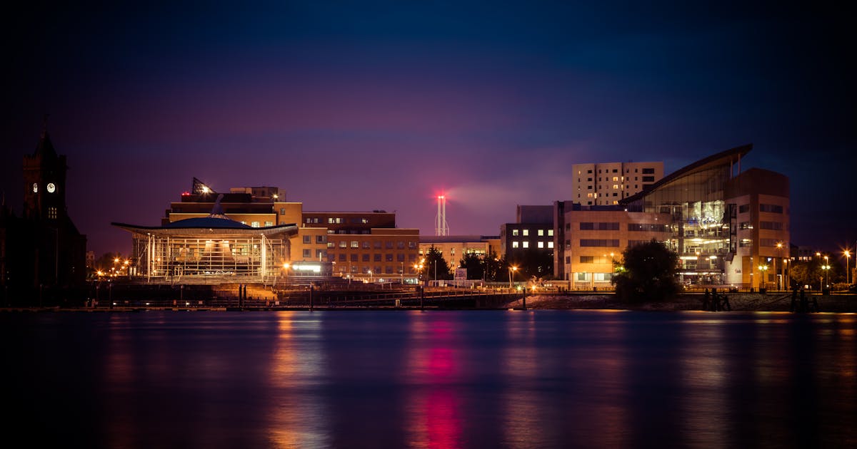 Cardiff Bay waterfront with the Senedd and Wales Millennium Centre at dusk