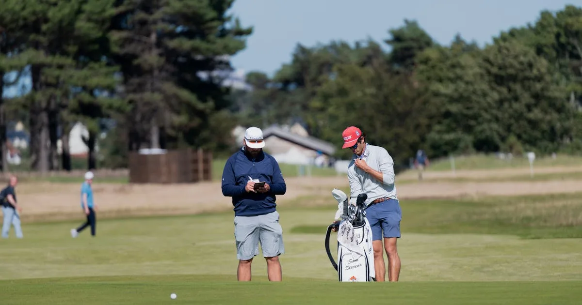 Two golfers preparing to play on a sunny Scottish golf course surrounded by rolling hills